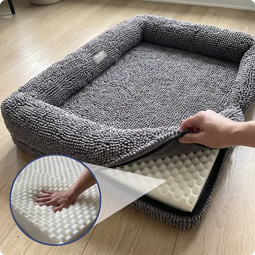 Angled view of Cloud K9 rectangle dog bed showing removable gray chenille cover and foam insert on a wood floor